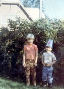 Dave Eaton family~ 1969c, Tim & Mark standing by bush