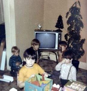 Dave Eaton family~ 1970c, Christmas at Winona Bunch home on 2nd Street, Aberdeen, WA- Kelly & Mark behind Mike & Duane Haskey (1st cousins)