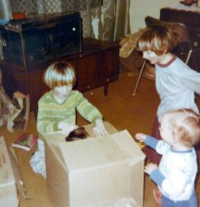 Dave Eaton family~ 1970c, Tim, Mark & Kelly with pup in a boz