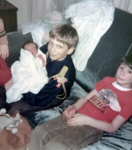 Dave Eaton family~ 1970c, Tim holding baby, Mark sits nearby