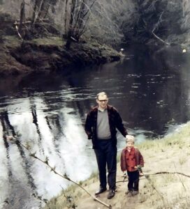 Dave Eaton family~ 1972c, Dave with son Kelly by East Hoquiam River below their house