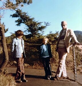 Dave Eaton family~ 1974c, Mark, Kelly & Dave by a cyclone fence