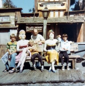 Dave Eaton family~ 1977c, Knott's Berry Farm, Tim, Kelly & Mark on bench with female statues
