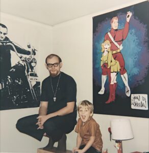 Dave Eaton family~ Dave & Tim in front of painting John Workman gave Dave