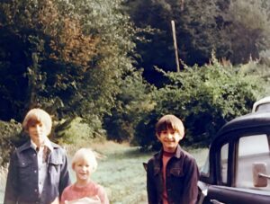 Dave Eaton family~ Tim, Mark & Kelly standing by 1958 Studbaker on East Hoquam farm