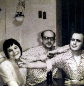 Eaton, Dave~ Michelle Haskey having her chin tweaked by husband Butch Haskey, b&w- 01