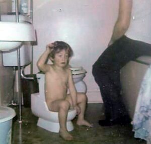 Eaton, Tim~ 1966, on his potty seat, dad waiting for him to finish