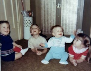 Eaton, Tim~ 1969, 01 mugging on floor; L-R= Mark, Tim, 1st cousins Keri & Glendene Gudaz